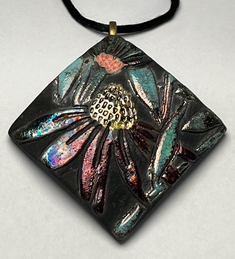 Untitled One of a kind handmade wildflower Raku pendant by Firecat Jewelry and Ceramics. Gorgeous metallic golds, blue, and green colors