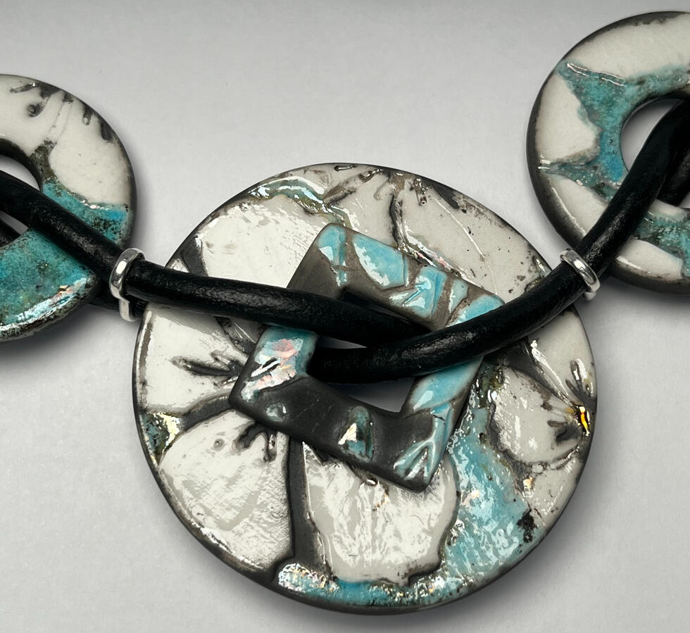 Untitled One of a Kind handmade Raku Tropical Flower Necklace by Firecat Jewelry and Ceramics. Gorgeous White and Blue Metallic Colors